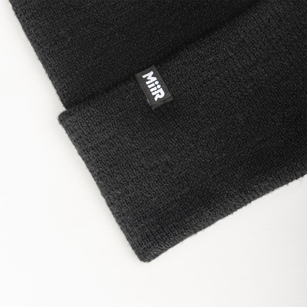 recycled-poly-fine-knit-beanie-b2 WebPDP-RecycledPolyFineKnitBeanie_Studio_TagDetail_Black__BNE005002OS.jpg