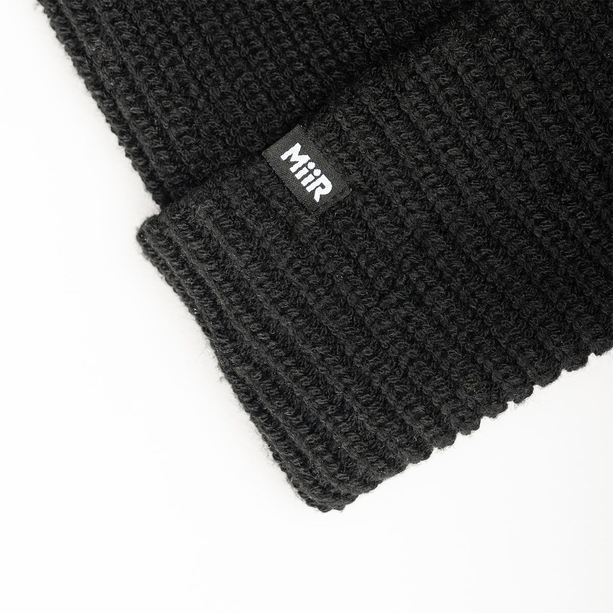 recycled-poly-rib-beanie-c7 WebPDP-RecycledPolyRibBeanie_Studio_TagDetail_Black__BNE002002OS.jpg